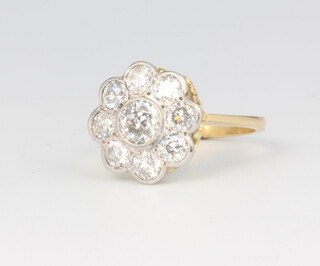 An 18ct yellow gold and platinum diamond daisy ring, approx. 1.75ct, size N, 15.4 grams