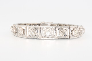 A white metal diamond bracelet set graduated stones, 18cm, 20 grams, approx. 2.3ct 