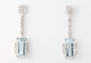 A pair of 18ct white gold aquamarine and diamond drop earrings, the aquamarines 4.63ct, the brilliant cut diamonds 0.83ct, 7 grams, 32mm 