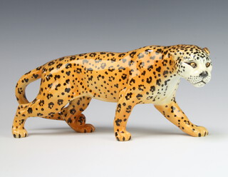 A Beswick figure of a leopard 1082, golden brown gloss, modelled by Arthur Greddington, 11.2cm 