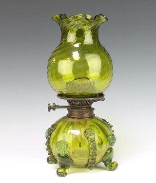 A 19th Century Continental green glass oil lamp with baluster base and flared neck shade 35cm 