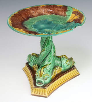 A 19th Century English Majolica tazza decorated with leaves, the base with 3 dolphins on a triform platform 20cm 