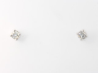 A pair of 18ct white gold brilliant cut diamond ear studs, approx. 0.5ct