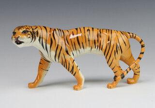 A Beswick figure of a tigress facing left, 1486 by Colin Melbourne, tan gloss 10.8cm