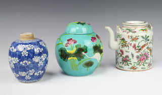 A Chinese turquoise glazed ginger jar and cover decorated with birds amongst flowers 14cm, a blue and white vase decorated flowers 12cm (no cover) and a Cantonese teapot decorated with insects 13cm (chipped spout) 
