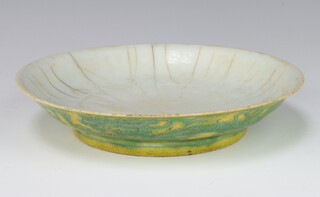An 18th Century style Chinese yellow ground shallow dish decorated with dragons, having a 6 character mark to the base 15cm 