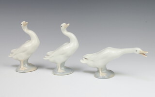 Three Lladro models of standing geese 12cm, 12cm and 7cm
