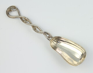 A Continental silver caddy spoon in the shape of a pumpkin with leaf handle, 15cm, 42 grams