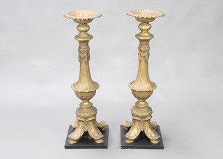 A pair of large and impressive Rococo style gilt metal pricket candlesticks raised on square bases, 71cm h x 22cm x 23cm d 