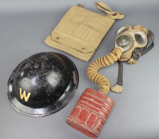 A Second World War air raid wardens helmet together with a Second World War webbing map case marked PSS 1944 and a WWII service respirator (rubber perished in places) 