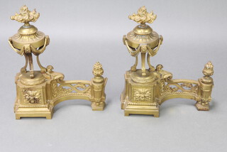 Two 19th Century right handed French pierced gilt metal Andirons (fire dogs) in the form of lidded urns 39cm h x 34cm w x 11cm d