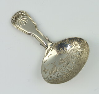 A George IV silver caddy spoon with shell handle, the bowl engraved with a dog chasing a bird, London 1824, 14 grams 
