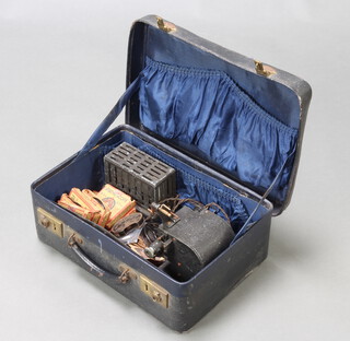 A Bingoscope projector, 3 Bingoscope 9.5mm films, 8 Pathescope 9.5mm films contained in a blue case 
