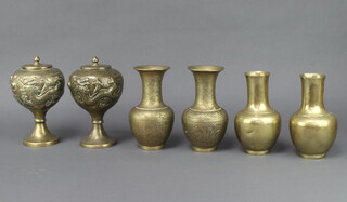 A pair of 19th/20th Century Chinese polished gilt bronze vases 8cm x 3.5cm and 2 pairs of 19th Century Chinese gilt polished bronze club shaped vases the bases with seal marks 18cm x 5cm 