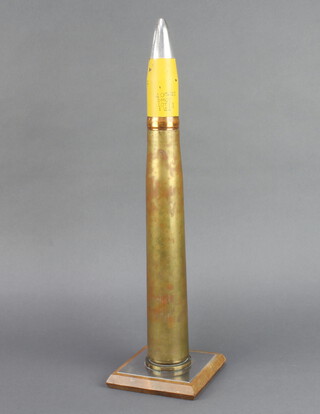 An anti aircraft shell, the top marked 40 M/M1VI, raised on a wooden base 48cm h x 12cm w x 12cm d 