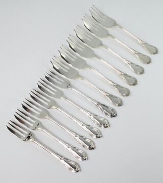 Twelve silver plated lily pattern cake forks
