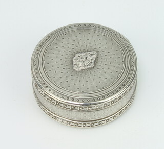 A 19th Century French engine turned silver circular pill box with geometric decoration, 54 grams, 5cm 