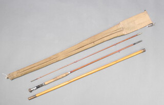 An Allcocks 9' split cane fly fishing rod with 2 tips, in a bamboo tip tube which doubles as a landing net handle, all contained in original cloth bag  