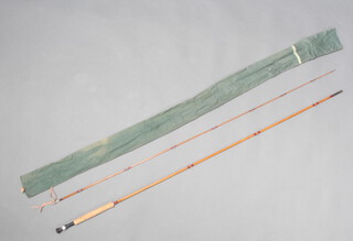 A 9'6" Pezon ET Michel parabolic syers still water split cane fly fishing rod with 6 line weight, built for Farlows and contained in a green cloth bag  