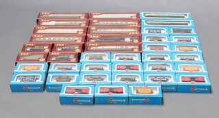 Two Airfix OO scale railway carriages boxed and 25 items of Airfix rolling stock, 8 Airfix GMR railway carriages and 5 items of Airfix GMR rolling stock, all boxed 
