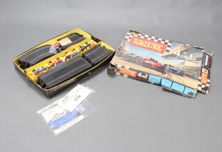 A Scalextric Set 80 boxed (some damage to the box), a sixth edition track circuit and racing rules and a ninth edition 