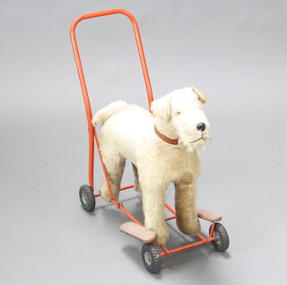 A child's 1960's push along toy in the form of a dog 50cm h x 47cm l x 25cm w
