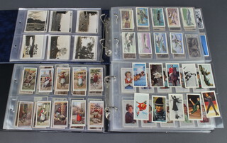 Two ring bound albums of cigarette cards including Wills, Rothmans, Players