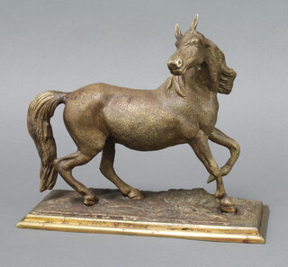A bronze figure of a walking horse raised on a rectangular base 20cm h x 25cm w x 9.5cm d 