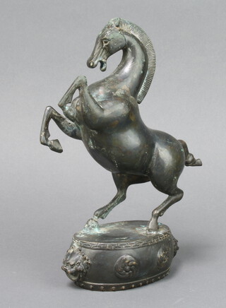 A Japanese bronze figure of a rearing horse raised on an oval base 24cm h x 11cm w x 7cm d 