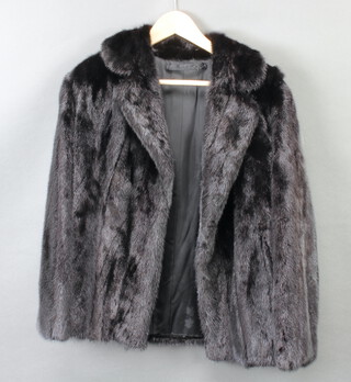 A lady's black mink fur coat 