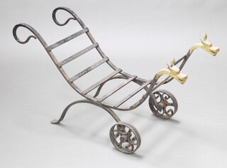 A wrought iron log cart with mythical beast ends 51cm h x 96cm l x 34cm w  