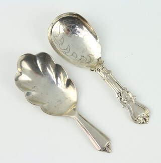 A silver caddy spoon with fancy handle Birmingham 1937, a Victorian ditto (rubbed marks) 24 grams 