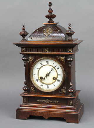 Junghans, a 19th Century striking bracket clock with 14cm enamelled dial and Roman numerals, contained in a carved wooden case 50cm h x 15cm w x 28cm d  
