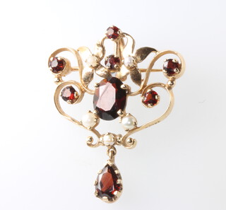 A Victorian style 9ct yellow gold open scroll brooch pendant, set with garnets and pearls 40mm, 6.4 grams 