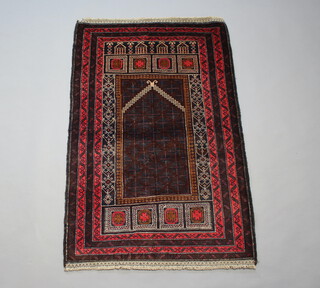 A red and brown ground Belouche rug 140cm x 92cm 