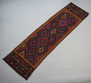 A Suzni brown and blue ground Kilim runner with diamond decoration 258cm x 74cm 