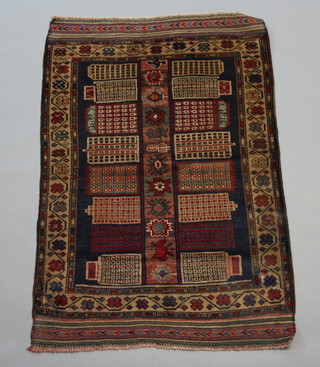 A red and brown Belouche rug with geometric design within multi row border 130cm x 88cm 