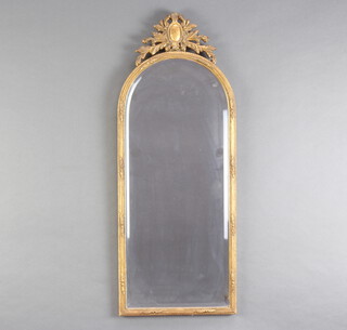 An arched bevelled plate mirror contained in a gilt frame 79cm x 31cm 