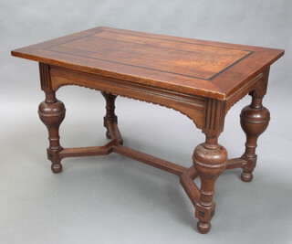 An 18th Century style Dutch oak centre table with ebony stringing, raised on cup and cover supports with Y framed stretcher 75cm h x 120cm w x 79cm d 
