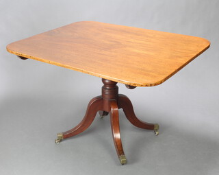 A Regency rectangular mahogany breakfast table raised on a turned column and tripod base with brass caps and casters 73cm h x 93cm w x 113cm d 