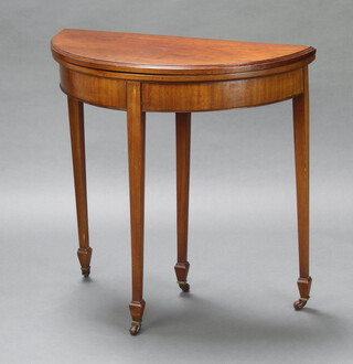 An Edwardian Georgian style mahogany demi-lune card table raised on square tapered supports, spade feet 77cm h x 76cm w  x 38cm d 