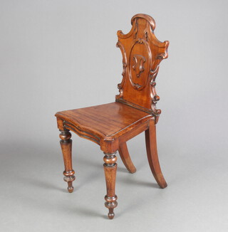 A Victorian mahogany hall chair with shaped back and solid seat, raised on cabriole supports 86cm h x 41cm w x 36cm d (seat 20cm x 23cm) 