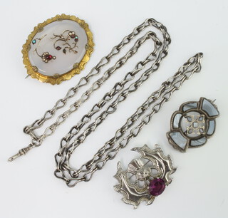 A Victorian hardstone brooch, 2 other brooches and a chain 