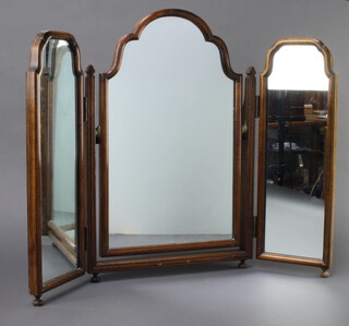 A Queen Anne style arched plate triple plate dressing table mirror contained in a mahogany frame, raised on bun feet 58cm h x 75cm 