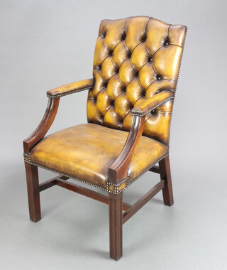 A Gainsborough style mahogany armchair upholstered in green buttoned leather 105cm h x 59cm w x 55cm d (seat 34cm x 34cm) 