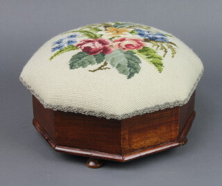 A Victorian octagonal mahogany spittoon with Berlin floral wool work seat and hinged lid, complete with china liner, raised on turned supports 13cm h x 28cm w x 39cm d 