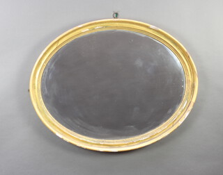 A 19th Century oval plate wall mirror contained in a decorative cushion shaped frame 71cm h x 89cm w x 6cm d 