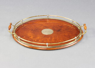 A 1930's oak and brass galleried twin handled tea tray 7cm h x 60cm w x 36cm d 