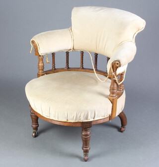 A Victorian mahogany tub back chair with spindle decoration upholstered in mustard coloured material, raised on turned supports 73cm h x 65cm w x 59cm d (seat 44cm x 40cm)