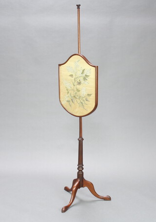 An Edwardian Georgian style pole screen with shield shaped banner, raised on column and tripod base 150cm h x 46cm w 